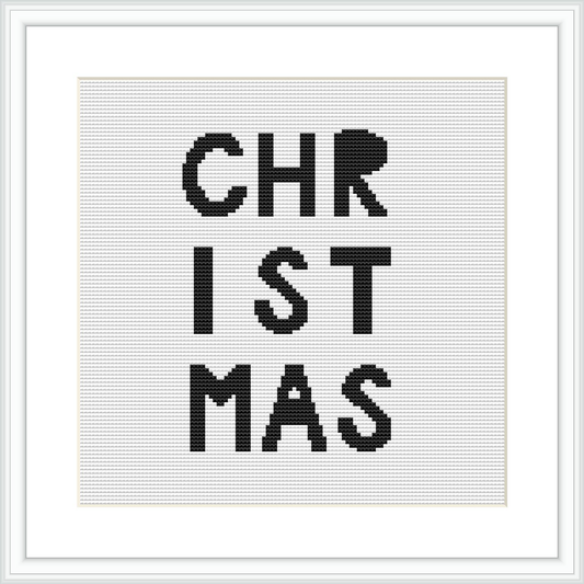 The image displays a framed cross stitch pattern with the word 'CHRISTMAS' spread out over three lines in a bold, sans-serif typeface. The letters are colored in black on a white canvas.