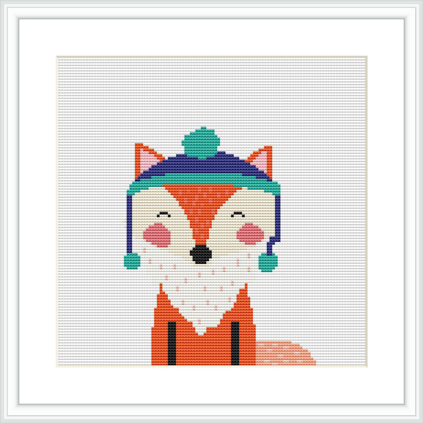 The image displays a cross stitch pattern framed in white, depicting a fox with a whimsical expression, wearing a winter Santa hat. The fox's fur is primarily orange, with white details and it has rosy cheeks and a closed-eye smile. The background appears to be a plain canvas.