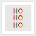 The image shows a cross stitch design with the text 'Ho Ho Ho', where each 'Ho' is arranged vertically and adorned with a circular pattern resembling Christmas wreaths, all stitched onto a white canvas framed in a simple white square frame.