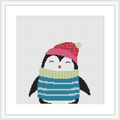 This is an image of a cross stitch pattern featuring a cartoon-style penguin. The penguin is wearing a red hat with a yellow pom-pom and a green and blue striped scarf. The penguin is depicted in a standing position against a plain white background, framed in a simple white frame.
