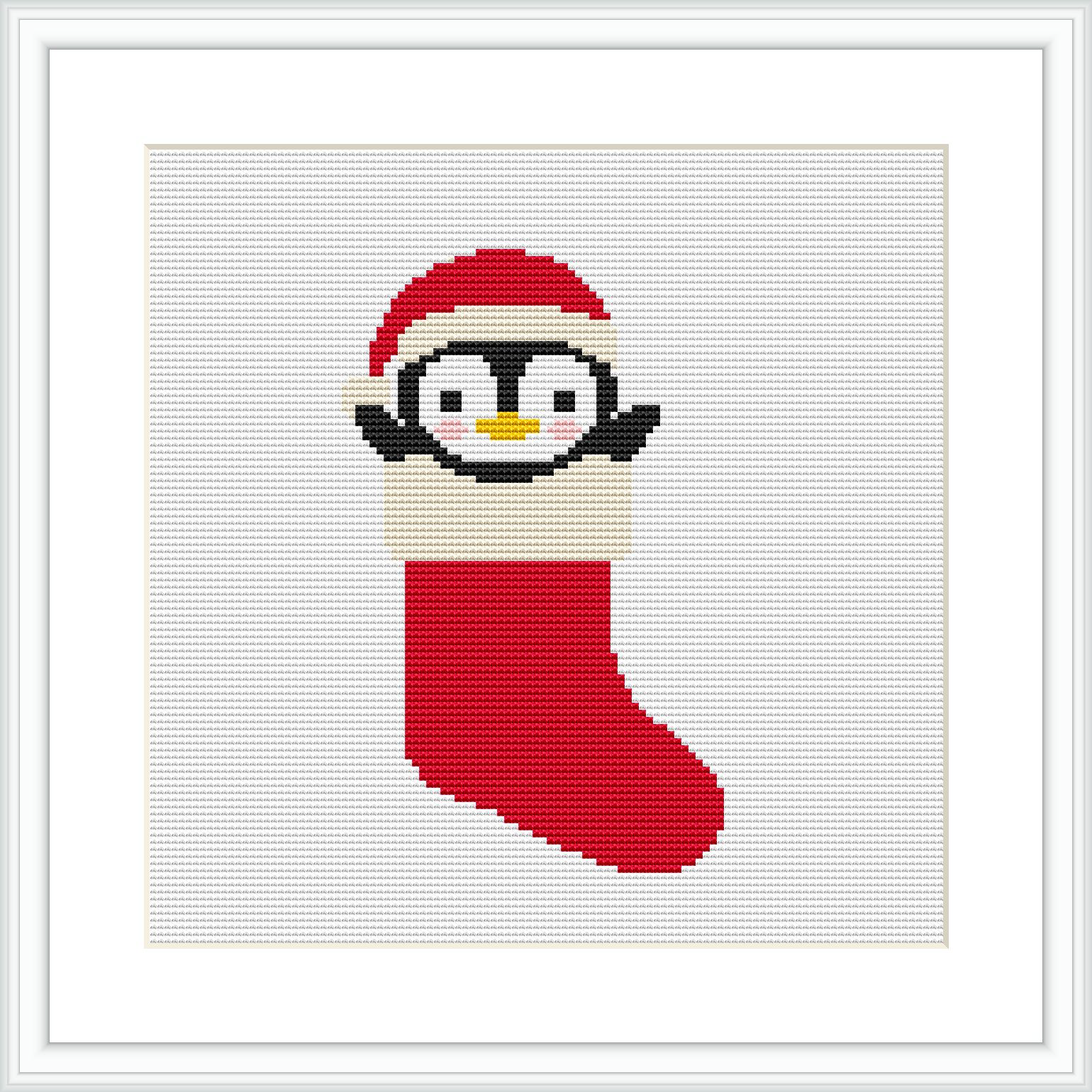 A cross stitch pattern depicting a cartoon-style penguin with a Santa hat poking out from a red and beige Christmas stocking. The background is white and the pattern is framed within a square frame.