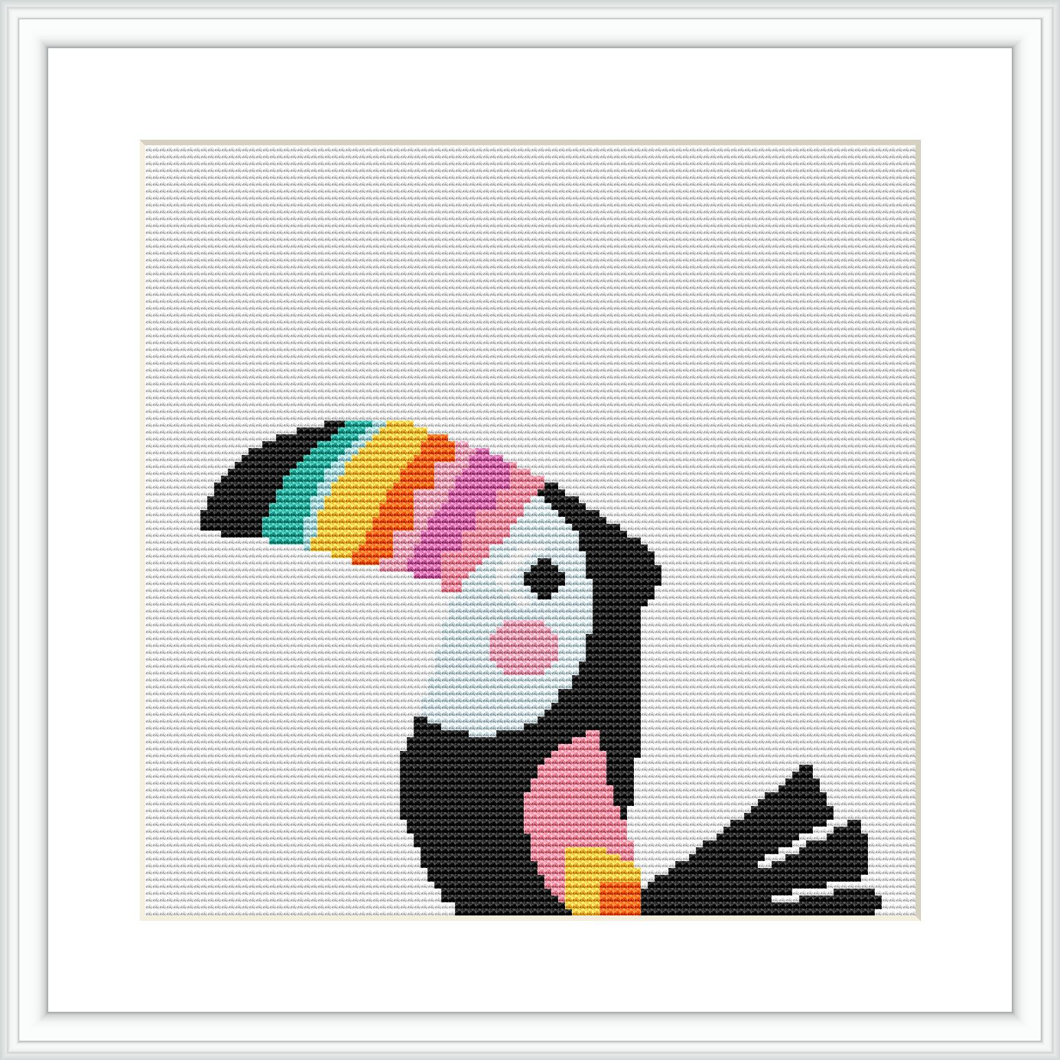 The image shows a framed cross stitch pattern of a stylized toucan with a tribal design influence. The toucan is composed of geometric shapes and sits against a white background.