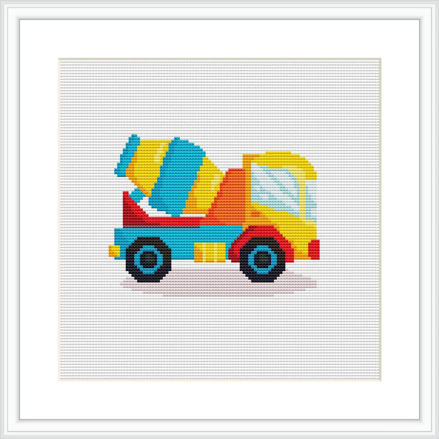 This is an image of a cross stitch pattern depicting a colorful concrete mixer truck. The truck is facing right, with a rotating drum, cabin and wheels detailed using colorful pixels against a white fabric background.