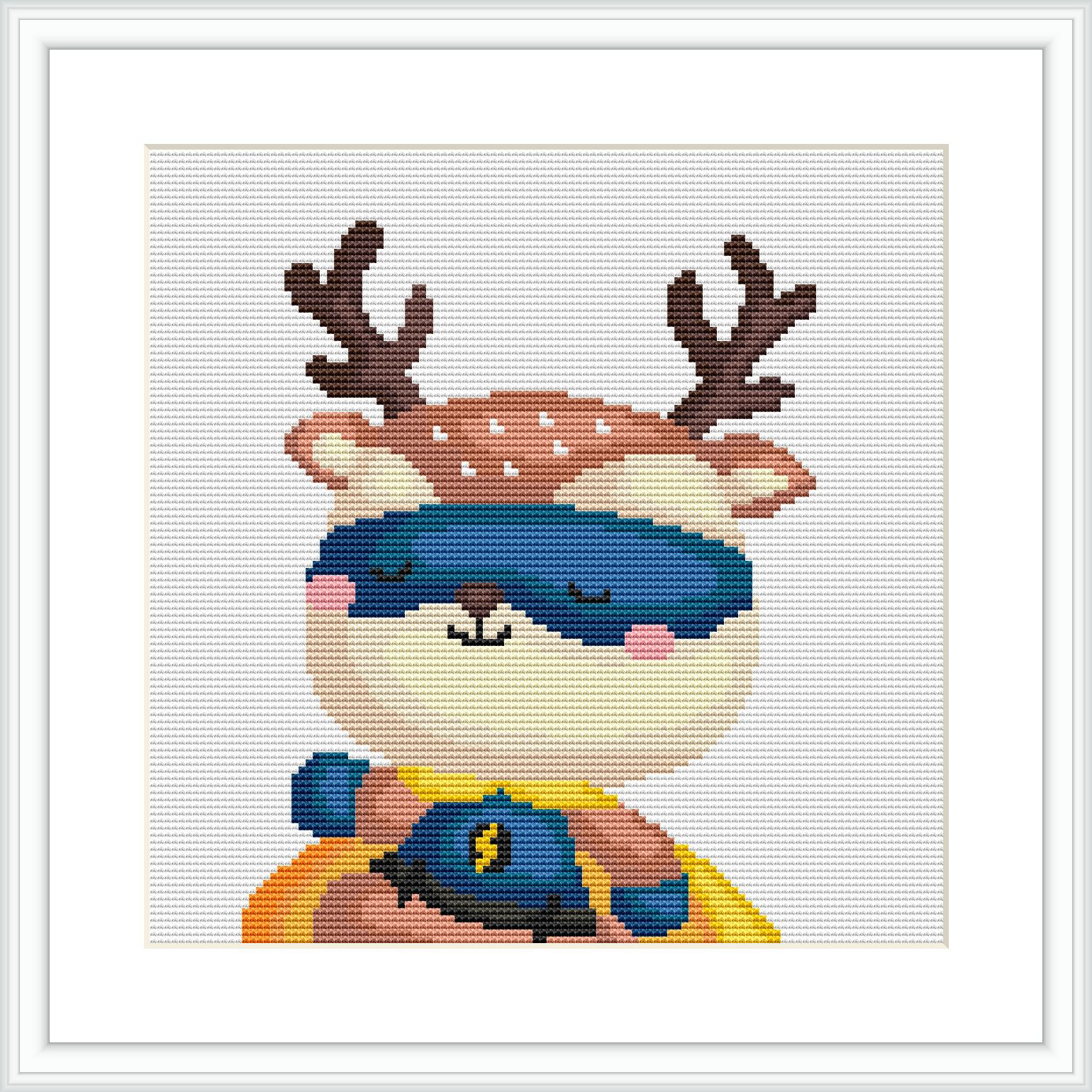 The image shows a cross-stitch pattern of a cartoon-style deer character dressed as a superhero, wearing a mask and a cape. The deer is closed-eyed as if taking a restful nap.