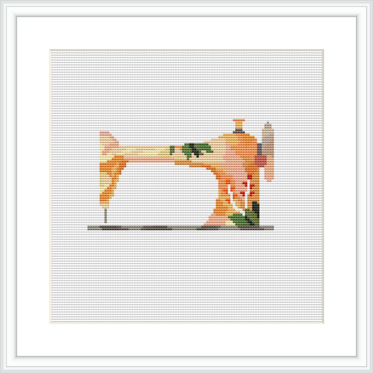 The image depicts a cross stitch pattern of a vintage sewing machine in a square format, rendered in a pixel art style with a limited color palette, encased within a simple frame.