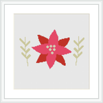 The image features a framed cross stitch pattern showcasing a stylized red and pink poinsettia flower with green and yellow foliage on a white background.