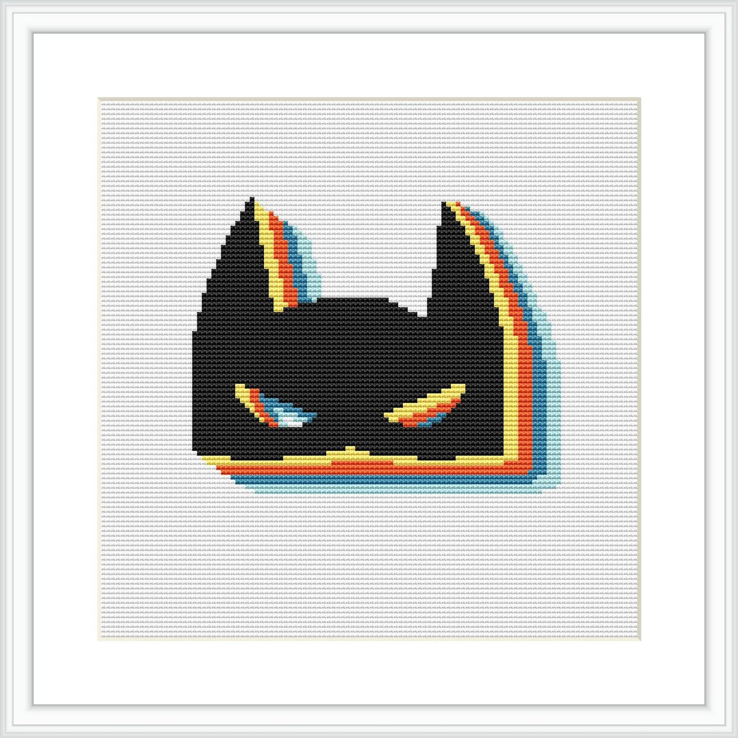 The image displays a cross stitch pattern framed in white, depicting a stylized version of a superhero's masked face, predominantly in black with colorful outline accents.