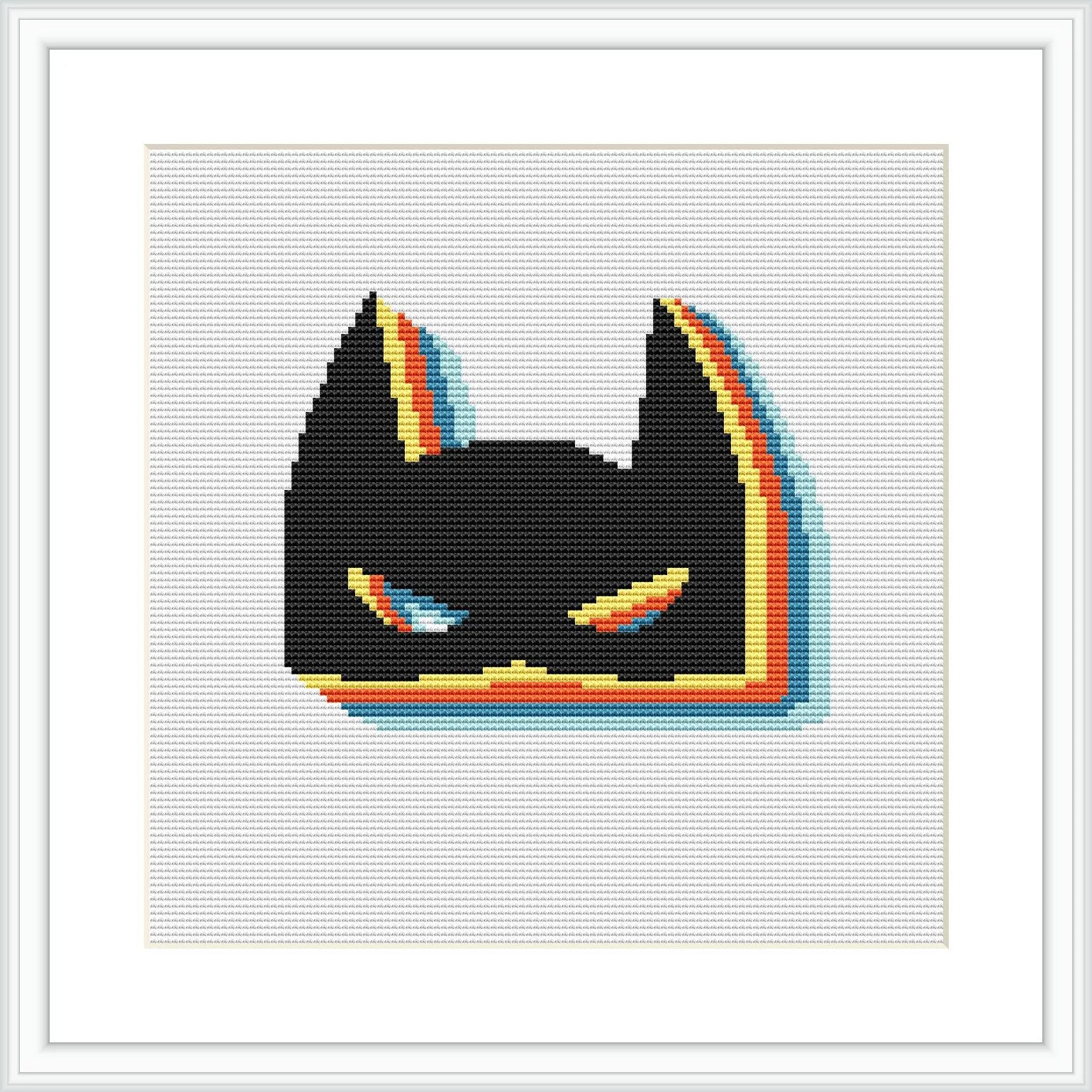 The image displays a cross stitch pattern framed in white, depicting a stylized version of a superhero's masked face, predominantly in black with colorful outline accents.