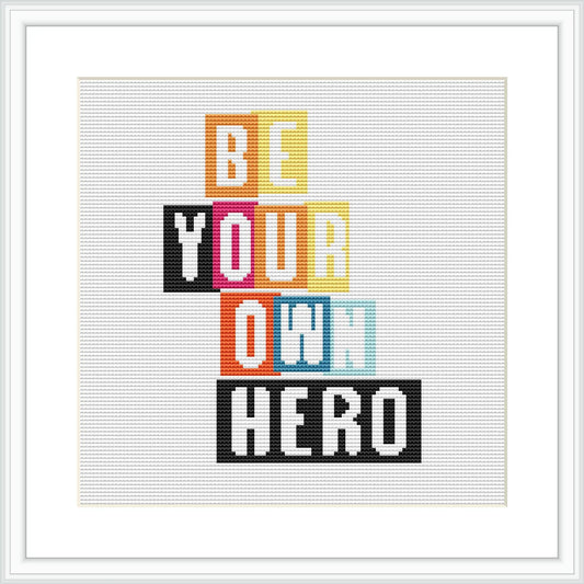 The design features the phrase 'BE YOUR OWN HERO' in block letters of varying colors, centered against a light background within a white square frame.