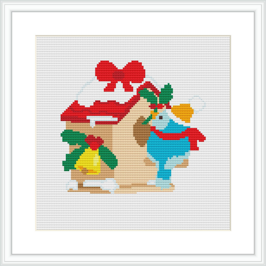 The image depicts a cross stitch pattern of a bird with a red bow on its tail, perched beside Christmas themed decorations including holly leaves and berries, golden bells, and a music sheet.