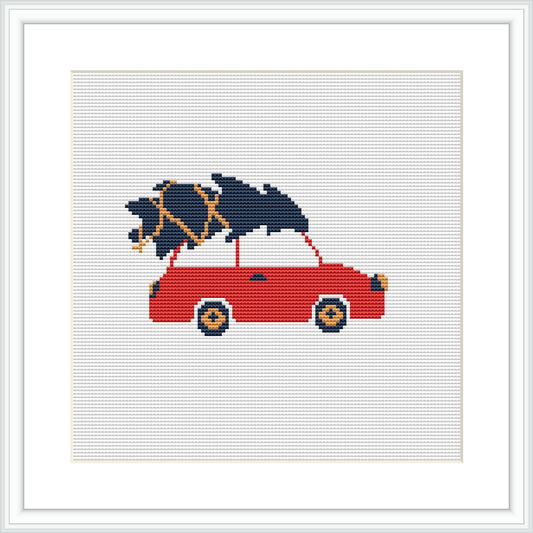 The image features a simple yet charming design of a red car in side profile view with a dark blue Christmas tree tied to its roof, all set against a white background suggesting snow or winter setting.