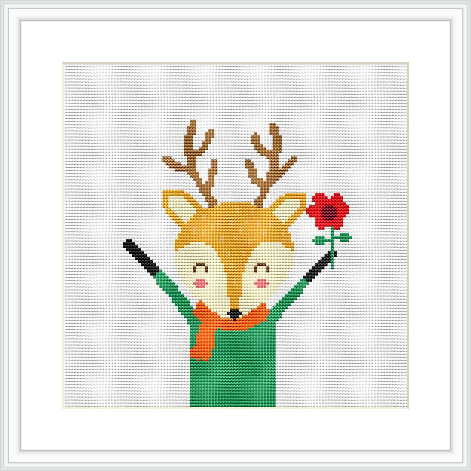 The image features a cross stitch design of a smiling deer head with antlers on a white background. The deer is depicted with yellow and brown shades, wearing a green garment. It is holding up a black wand in one hand and a red flower in the other.