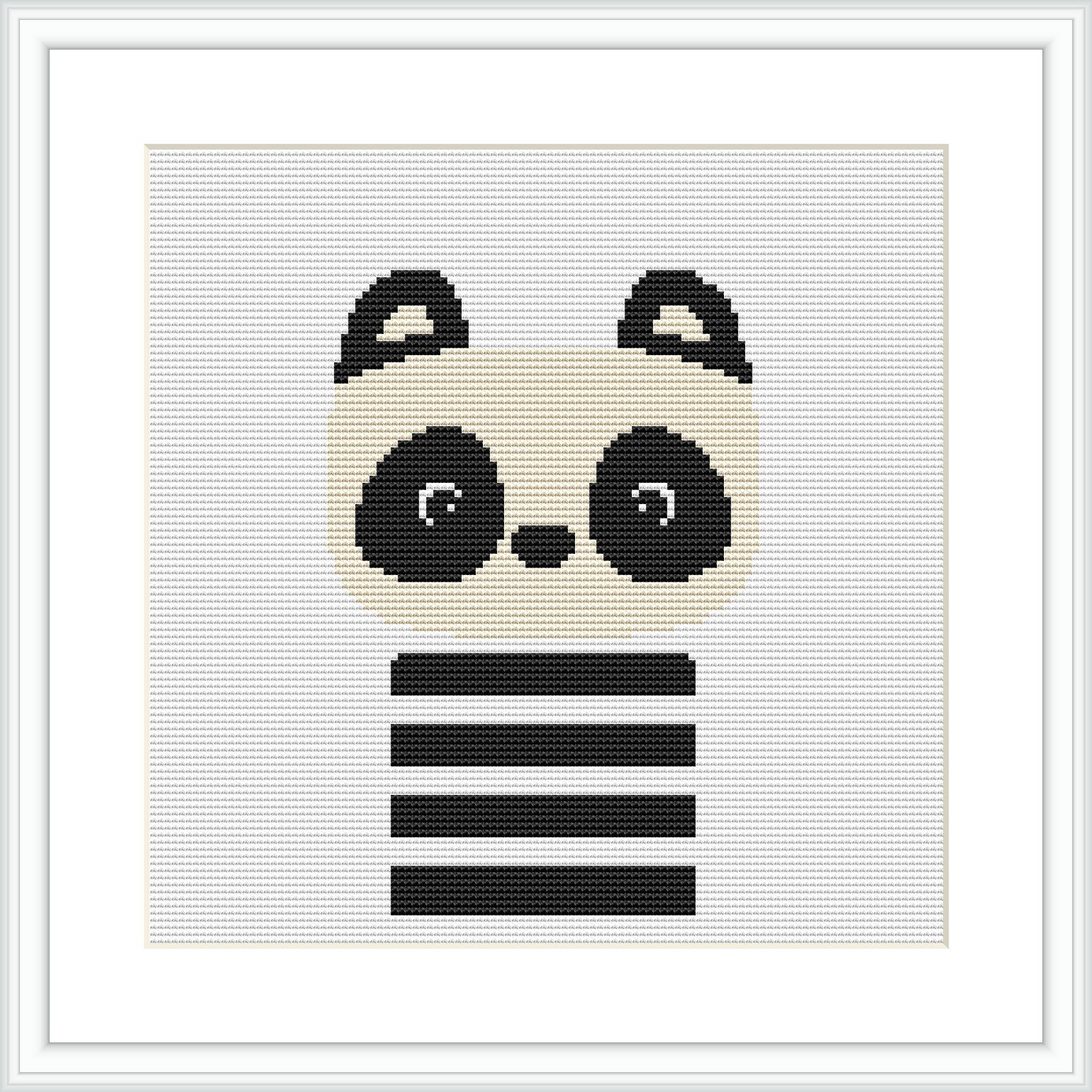 The image shows a minimalist style cross stitch pattern featuring a stylized panda bear's face with pronounced circular eyes and ears, separated by horizontal stripes across its body. The pattern is centered on a white background framed with a simple square border.