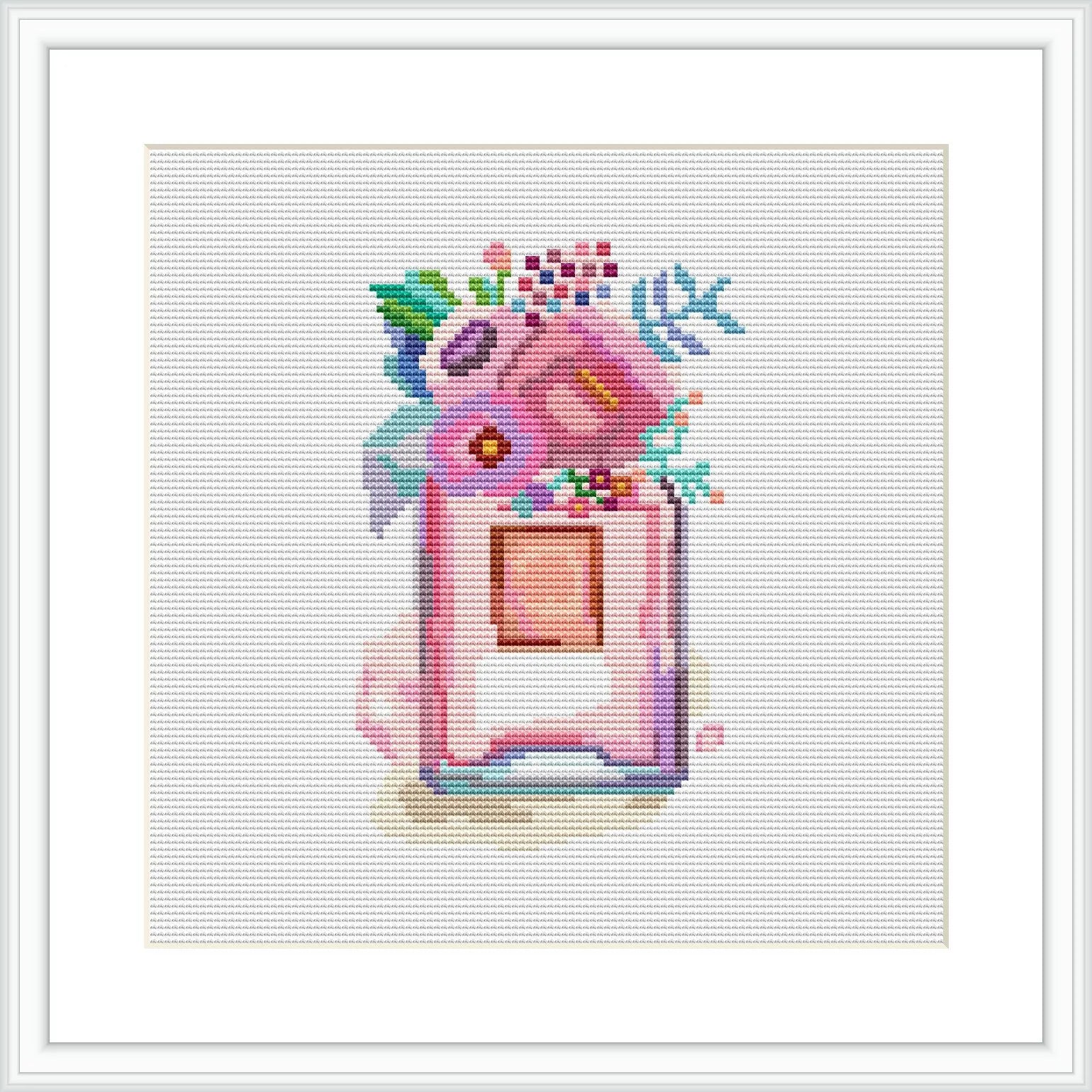 The image depicts a whimsical portrayal of a hot cocoa cup with flowers blooming from the open top, set against a plain white background. The overall presentation is framed within a simple square border.