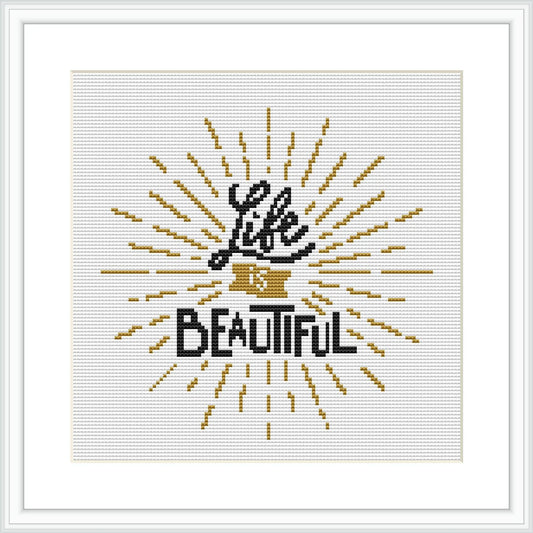 The image displays a cross stitch pattern featuring the phrase 'Life is Beautiful' centered on a white canvas. The text is surrounded by radial lines that create a sunburst effect, primarily in gold and black tones.