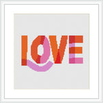 The image features the word 'LOVE' in capital letters, laid out in a pixelated effect with a heart shape replacing the 'O'. The typography is displayed against a plain white background and it's framed in a simple white square frame.