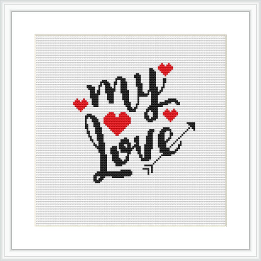 The image displays a cross stitch pattern featuring the phrase 'my love' in stylized black lettering, adorned with small red hearts and a cupid's arrow through the letter 'o'. The design is contained within a simple square frame on a white background.