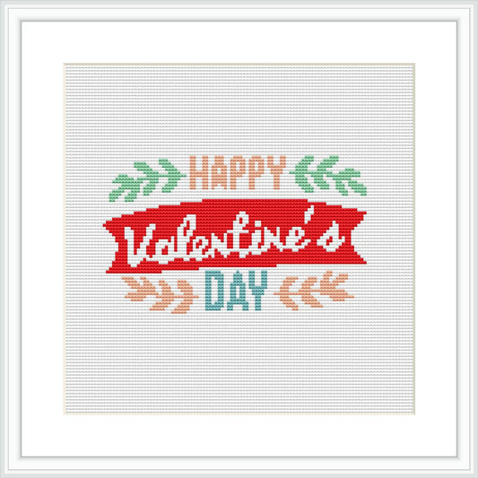 The image showcases a square cross-stitch pattern featuring a stylized banner with the text 'Happy Valentine's Day' surrounded by decorative elements like foliage and arrows.