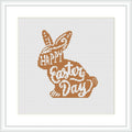 The image displays a cross stitch pattern featuring a bunny silhouette with the words 'HAPPY Easter DAY' inside it. The pattern uses shades of brown and is framed on a white canvas within a square frame.