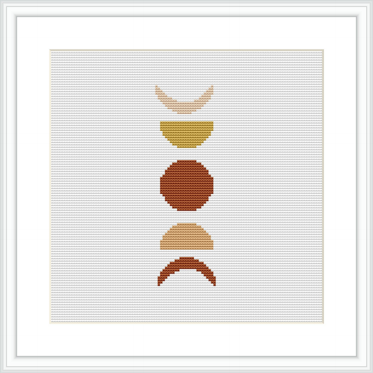 The image features an abstract cross stitch pattern consisting of four geometric shapes aligned vertically. These shapes resemble a modernist composition, featuring clean lines and a simplistic aesthetic. The piece is framed, showcasing the art against a background of white aida cloth.