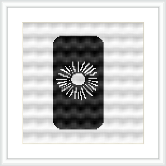 The image depicts a cross stitch pattern with a central abstract motif resembling a radiating design, framed within a rectangular area. The stitching is primarily in black with negative space creating the design on a white fabric background.