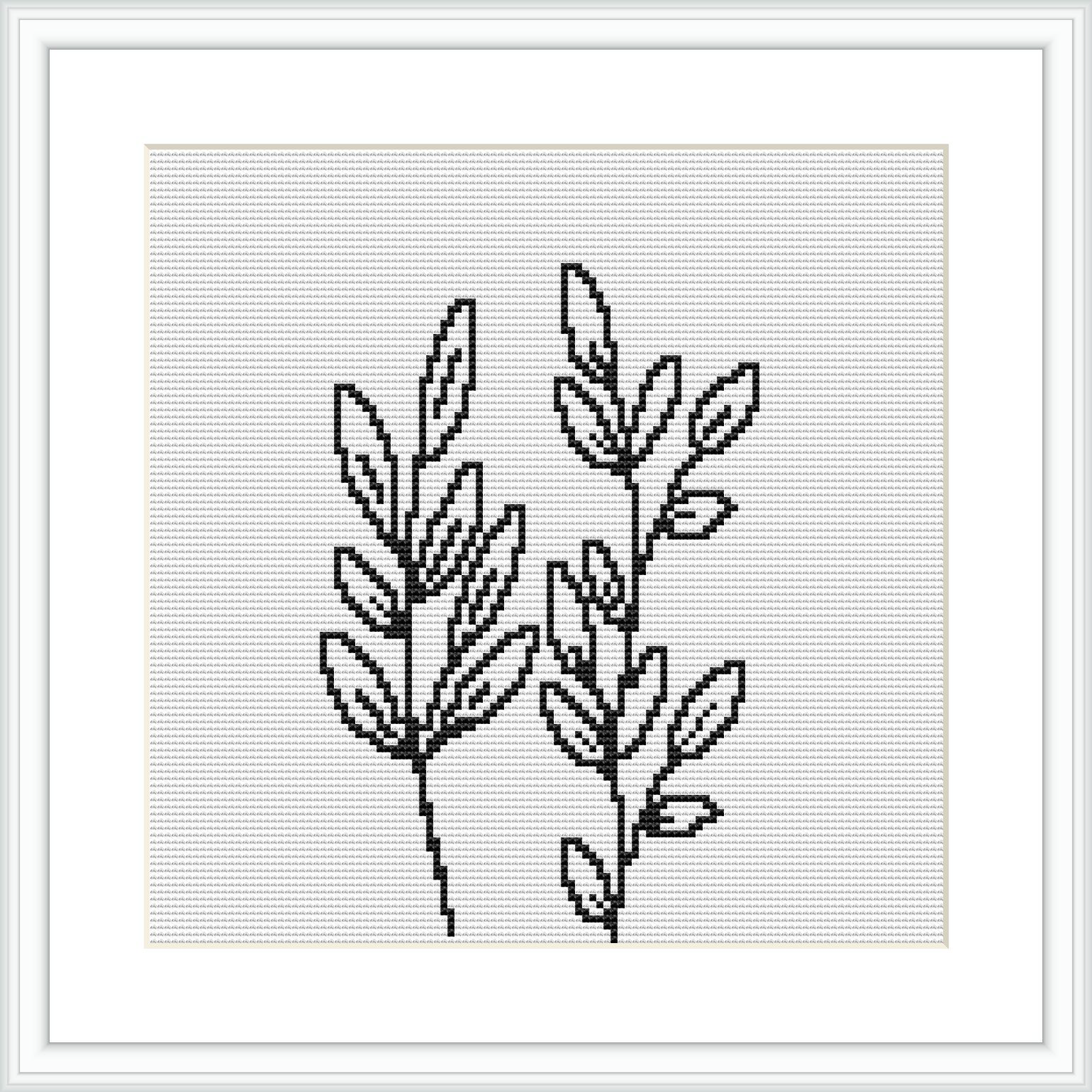 The image displays a cross stitch pattern of two plant sprigs which exhibit a minimalist and modern design. They are rendered in a monochrome color scheme, predominantly black on a white canvas. The pattern is framed, ready for display.