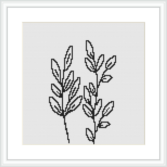 The image displays a cross stitch pattern of two plant sprigs which exhibit a minimalist and modern design. They are rendered in a monochrome color scheme, predominantly black on a white canvas. The pattern is framed, ready for display.