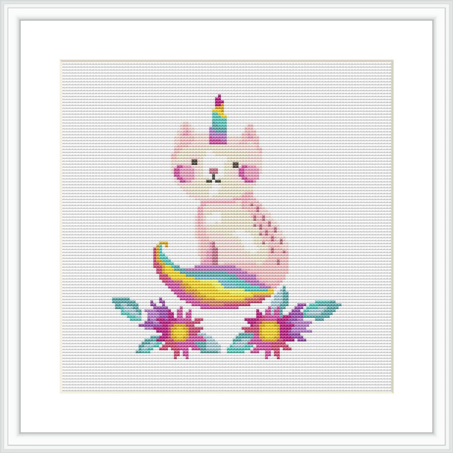 The image showcases a cross stitch pattern of a pink caticorn with a multicolored tail and horn, seated in the center. It is surrounded by flowers with purple petals and yellow centers, set against a plain white background.