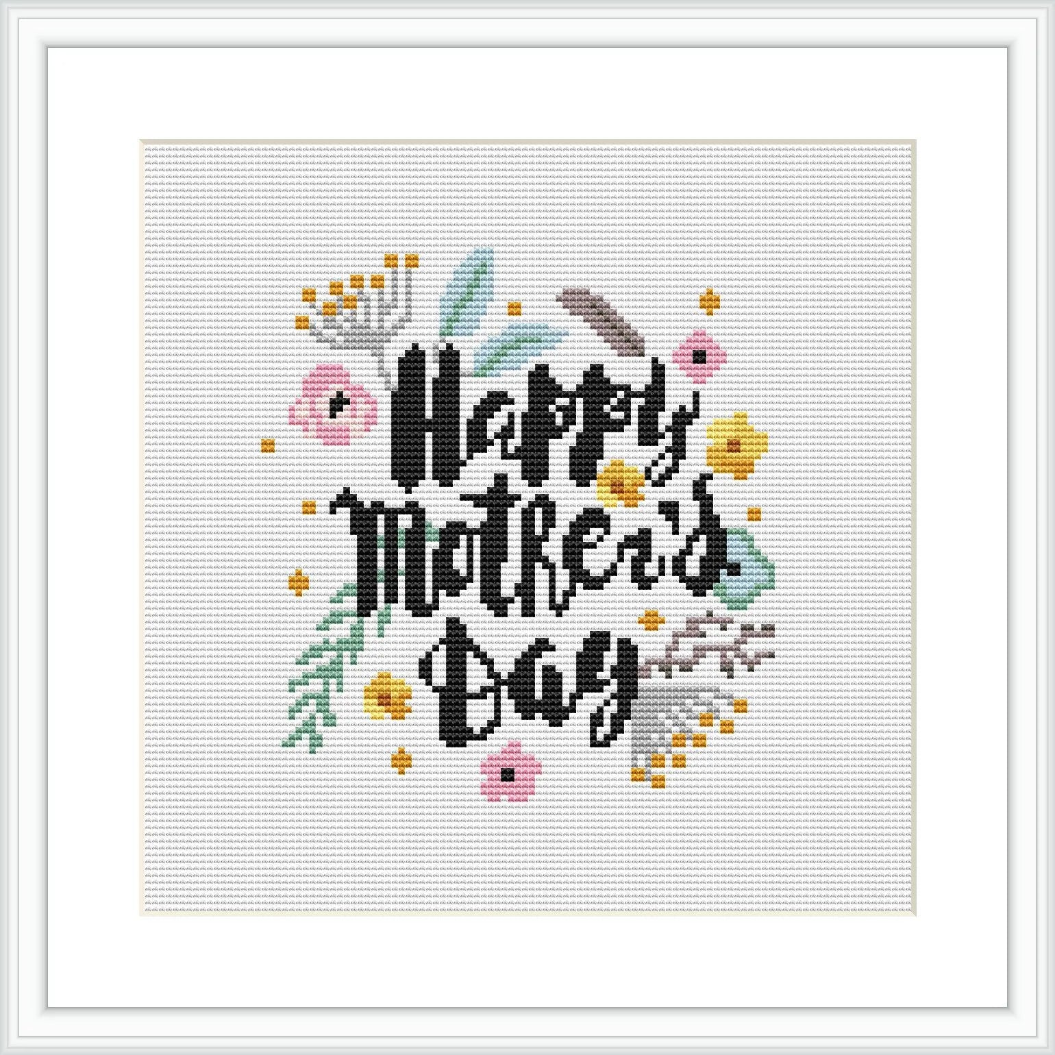 This cross stitch pattern displays the phrase 'Happy Mother's Day' in stylized, cursive typography at the center. Surrounding the text is an assortment of flowers and leaves, creating a wreath-like appearance. It is framed within a simple square border, showcasing the design on an ivory white background.