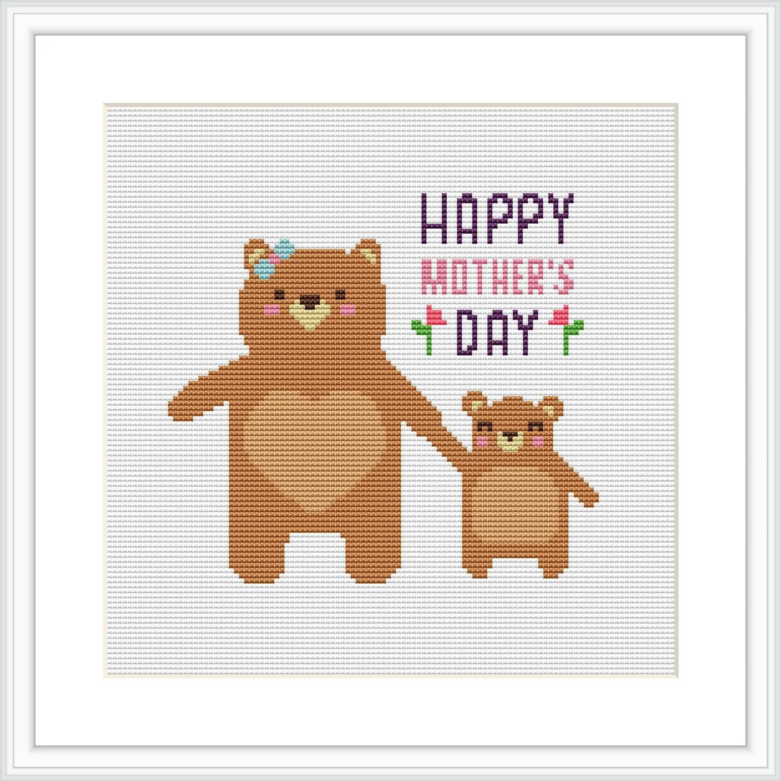 The image displays a framed cross stitch pattern with two brown bears, a mother and her cub. The words 'Happy Mother's Day' are stitched above them in colorful letters, and the bears are surrounded by a simple, minimalist background.