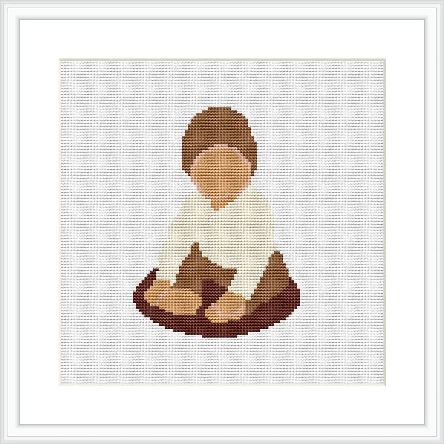 The image depicts a cross stitch pattern of a baby boy seated on the ground. He is wearing a white top and brown pants, immersed in play with an unidentifiable object.