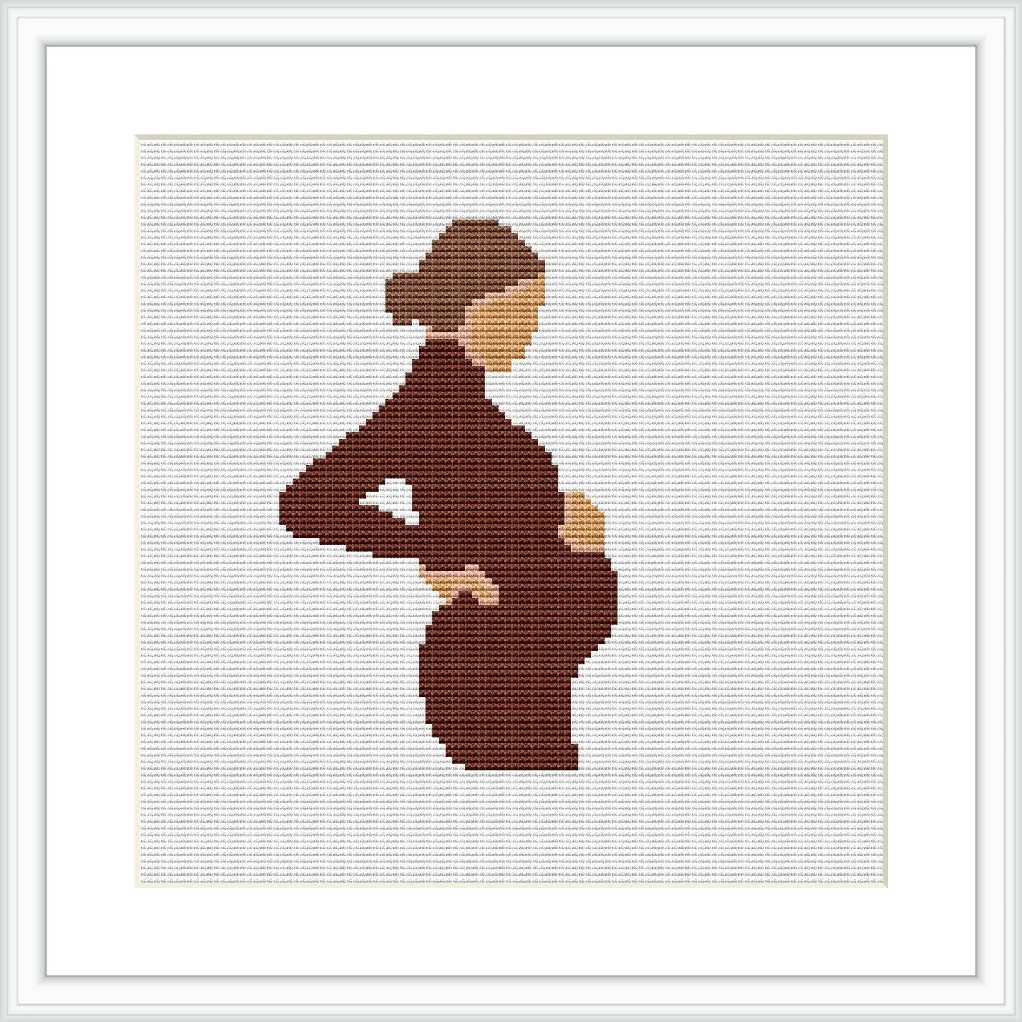 The cross stitch pattern depicts the silhouette of a pregnant woman cradling her belly. She is facing sideways, and the background is plain, highlighting her figure.