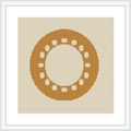 The image displays a framed cross stitch pattern hanging on a wall. The design depicts a centered circular motif made up of small geometric shapes, predominantly in shades of yellow, on an ecru or light beige aida cloth.