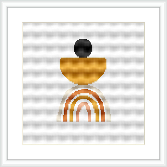 The image shows a cross stitch pattern framed in white, depicting a modern, abstract vase motif in earth tones, with a circular element on top, all on a white background.