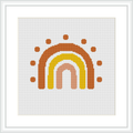 A cross stitch pattern of a simplified rainbow arch composed of dots, presented in a frame, on a white background.