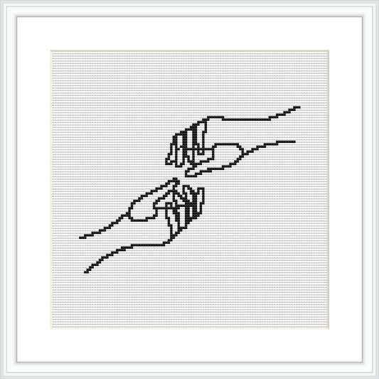 The image displays a cross stitch pattern featuring two human hands engaged in a delicate touch. The hands are intricately stitched using a series of black lines on a white canvas, framed with a simple black frame against a white background.