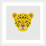The image shows a cross stitch pattern of a leopard's face centered within a square canvas, framed by a simple white border. The leopard's eyes are highlighted in aqua, contrasting the yellow and black-spotted fur.