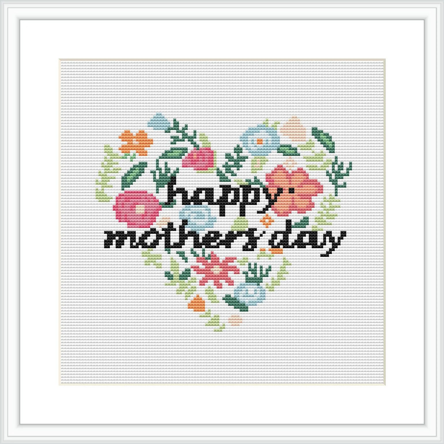 This image shows a square cross stitch pattern with a floral heart design. Various flowers in soft colors form a heart shape, with 'happy mother's day' written in cursive in the center. The pattern is surrounded by a simple border, and it's displayed as if it's on a white canvas or fabric.