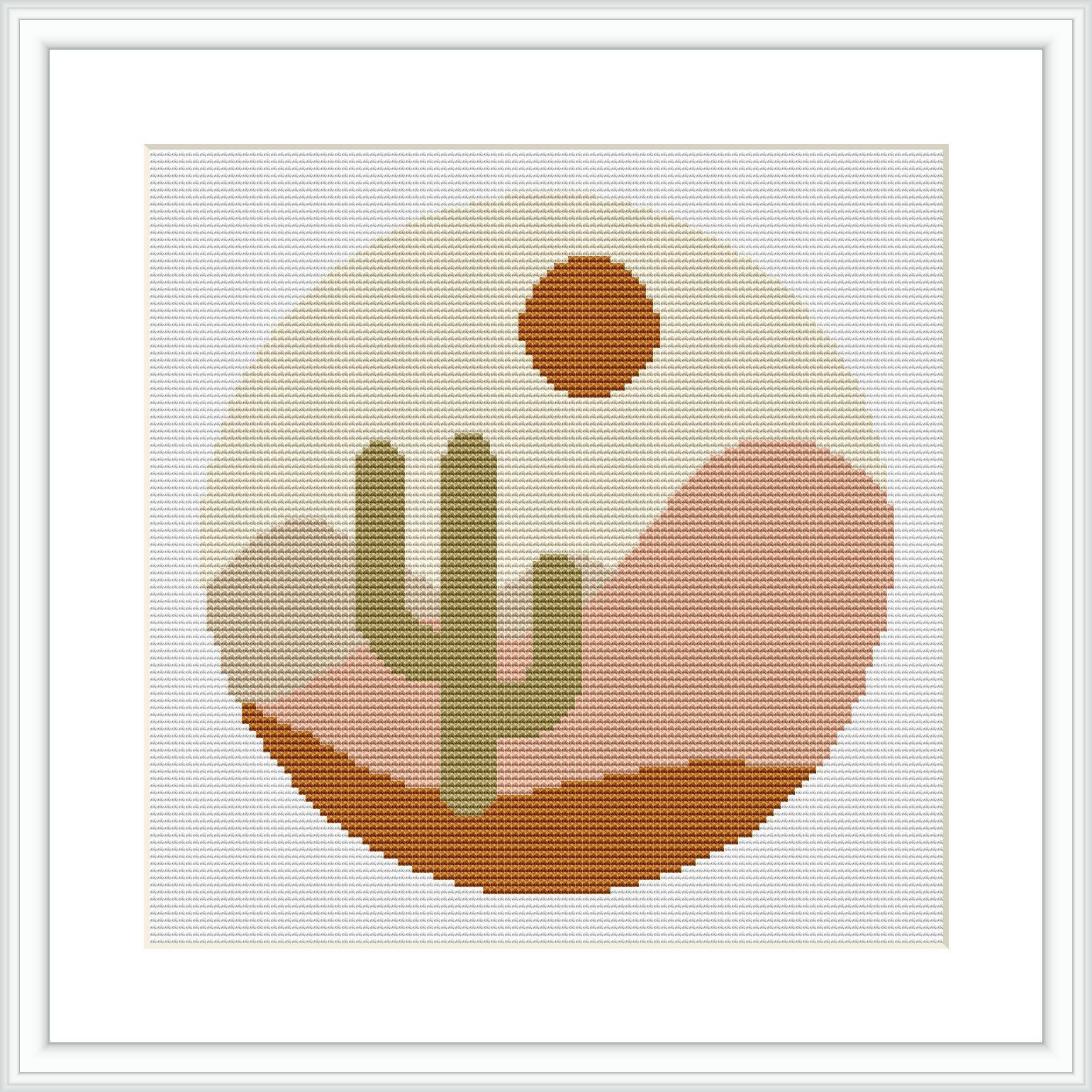A framed cross stitch pattern showing a stylized desert scene with a cactus, rolling hills and a setting sun within a circle, all rendered in a pixel-like geometric style.