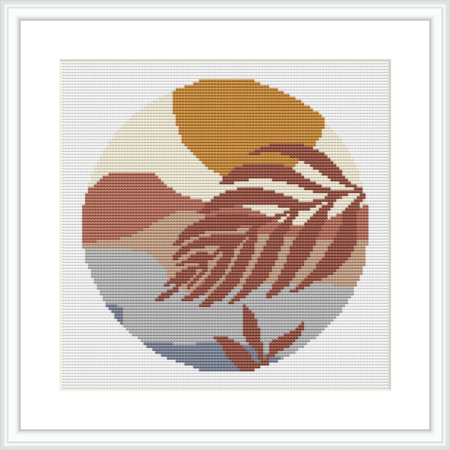 The image features a circular cross stitch pattern with the silhouette of a woman in profile. The pattern is designed with earthy colors, using shades of beige, brown, gray, and cream. It is framed within a white square background and encapsulated by a simple border.