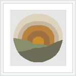 The image shows a cross stitch design featuring a stylized, simplistic sunrise with a yellow center, an orange ring around it, and a larger beige ring enclosing the orange. The bottom half depicts two green hills in a darker tone in front and a lighter tone in the back under a circular backdrop.