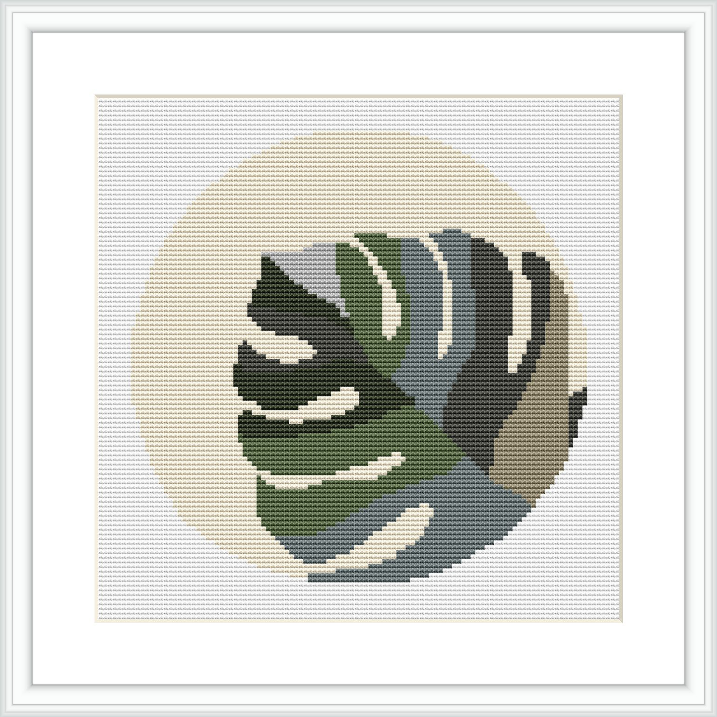 The image displays a framed cross stitch pattern of a Monstera leaf set against a cream-colored, circular background, surrounded by a white border.