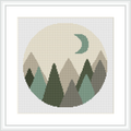 This cross stitch pattern features a circular design with geometric shapes forming a mountain range in the foreground and a crescent moon in the background.