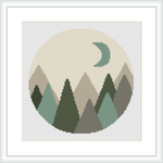 This cross stitch pattern features a circular design with geometric shapes forming a mountain range in the foreground and a crescent moon in the background.