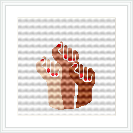 The image features a cross stitch pattern of two hands interlocking fingers, with a predominant color palette consisting of beige, browns, and touches of red and white. The pattern is centered on a white canvas, within a square frame.