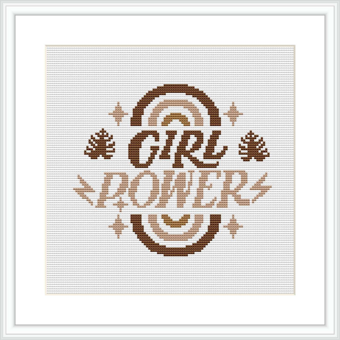 The image showcases a framed cross stitch sampler with the words 'GIRL POWER' in a bold font at the center, surrounded by ornamental floral elements and accents in shades of brown.