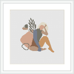 A cross stitch pattern depicting an abstract human figure in a seated pose with geometric shapes and organic ornamentation in a pastel and neutral color scheme.