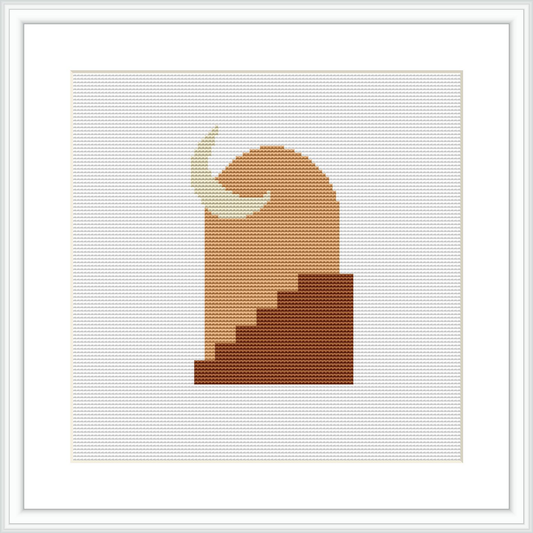 The image showcases a cross stitch design framed in white, depicted on a white background. The design features geometric steps ascending in shades of brown, with a crescent moon at the top on a cream backdrop.