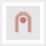 A framed cross stitch piece featuring a series of concentric arches or rainbows in various shades of nude and pink, centered around a large circular motif.