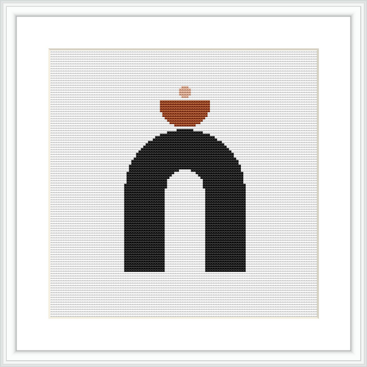 The image showcases a framed cross stitch pattern featuring a black arch with a terracotta pot resting on top. The background is white, and the design is centered within the frame.